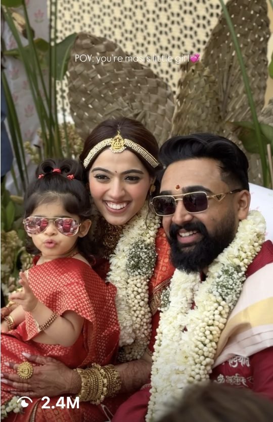 Couple with their niece in matching sunglasses