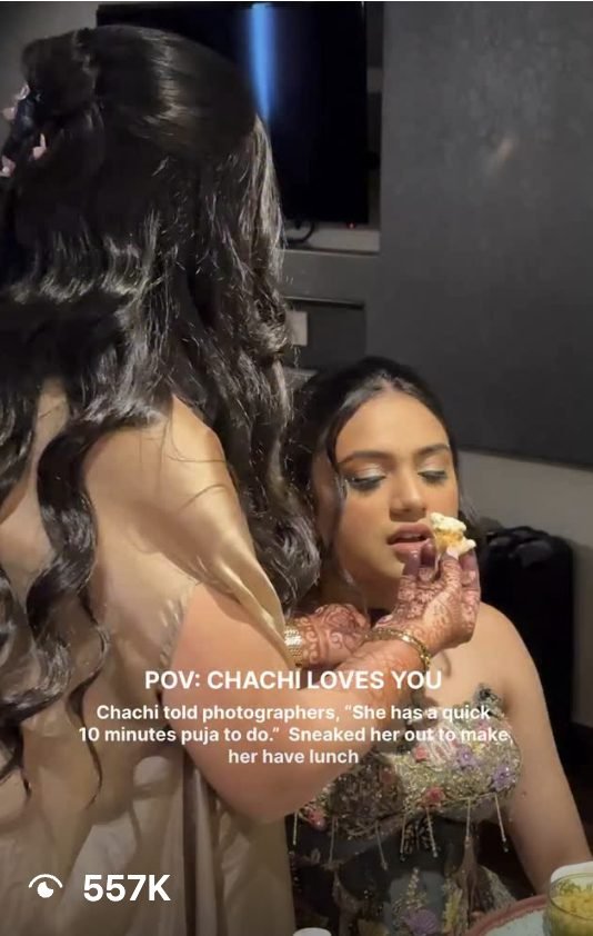 Aunt feeding the bride lunch between rituals