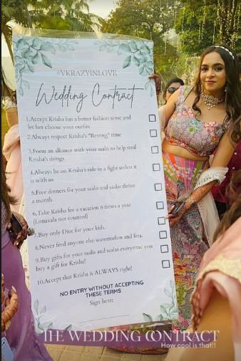 Wedding contract story held up by the bride's friends